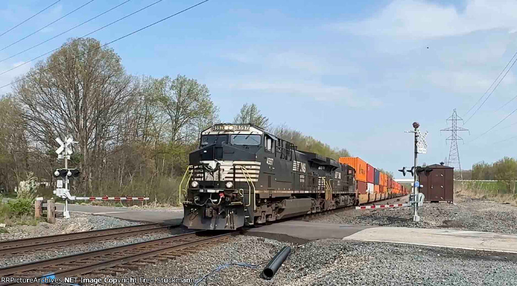 NS 4597 runs eastbound with intermodal freight.